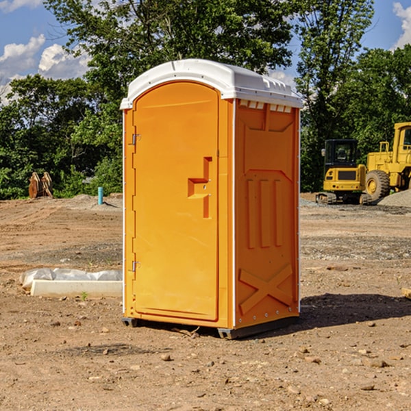 what is the cost difference between standard and deluxe portable restroom rentals in Briggsdale